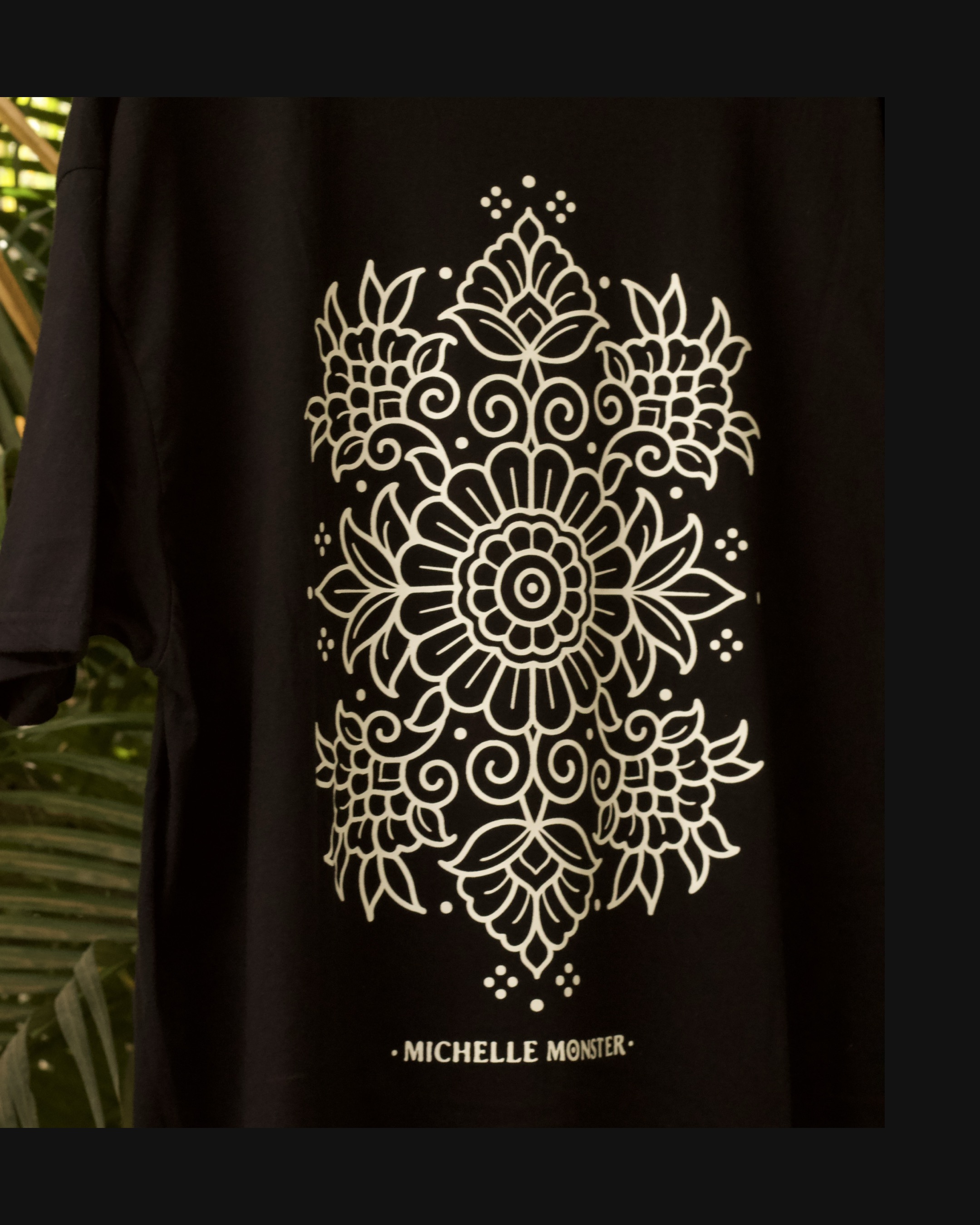 Black Michelle Monster shirt with large ornamental back design